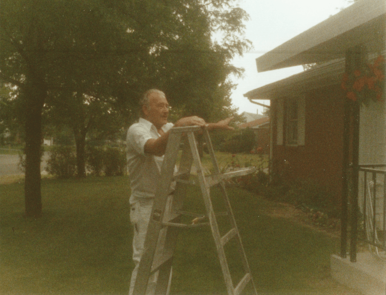 Richard Wilkens painting a cousin's house in Bowling Green, Ohio. Throughout his life as a painter, he always chose and cared for durable, long-lasting supplies. Photograph. Ca. 1986. The Wilkens Family Collection.